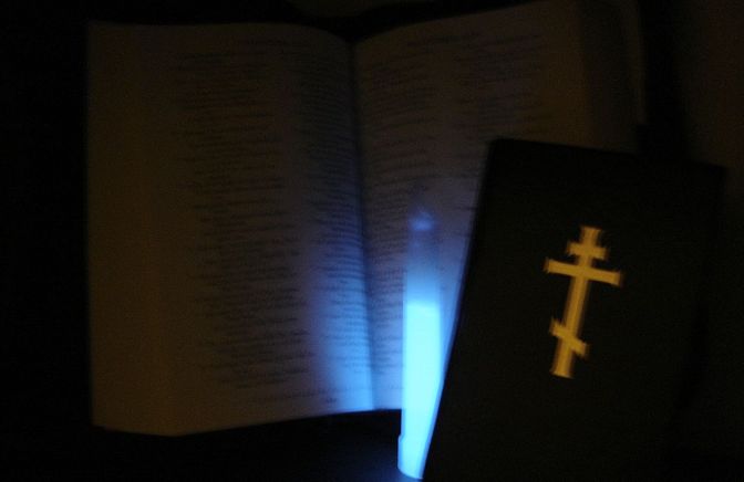 stick light Bible prayer book
